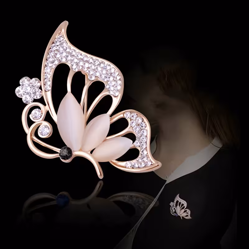 1 elegant Golden butterfly brooch set with sparkling synthetic.